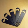 Sleek black flat bottle opener for effortless beverage enjoyment, durable and stylish design for easy use.