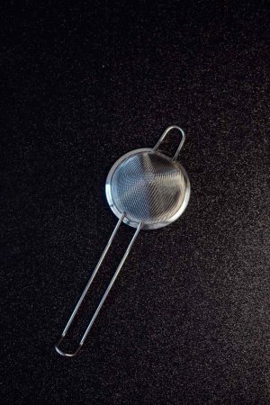 Silver Fine Mesh Strainer - For Precise Cooking & Baking Needs. High-Quality Stainless Steel Kitchen Tool for Straining, Sifting, and Draining.