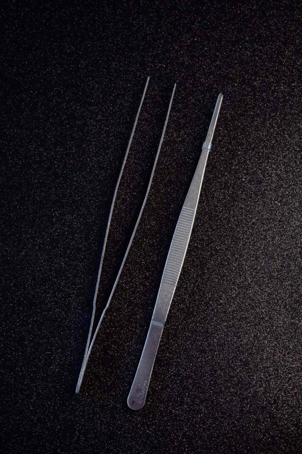 Precision tweezers for intricate decorating tasks, fine quality tool for precise grooming and crafting, essential beauty accessory.