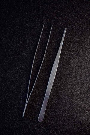 Premium precision tweezers for intricate decorating, essential tool for crafting and grooming tasks